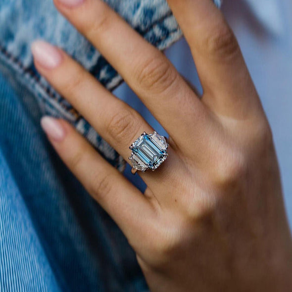 Light Aquamarine Emerald Cut Three Stone Engagement Ring In Sterling Silver