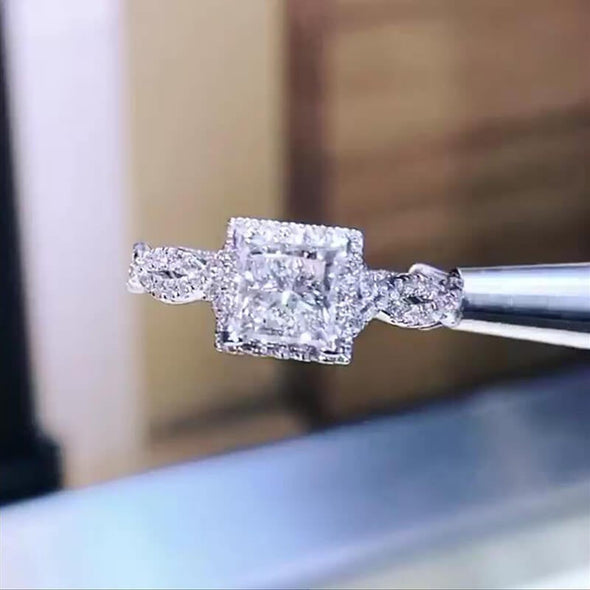 Princess Cut Twisted Halo Engagement Ring In Sterling Silver